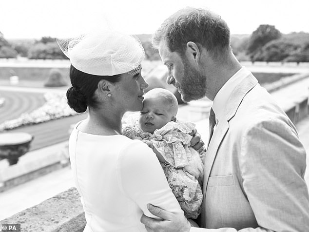 15709264-7220343-A_second_shot_in_black_and_white_shows_Meghan_dressed_in_white_g-a-86_1562446657742